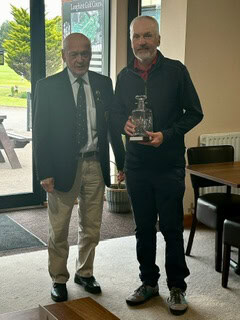 Alan McBride being presented with the RW Johnson Decanter by Brian Aisbitt